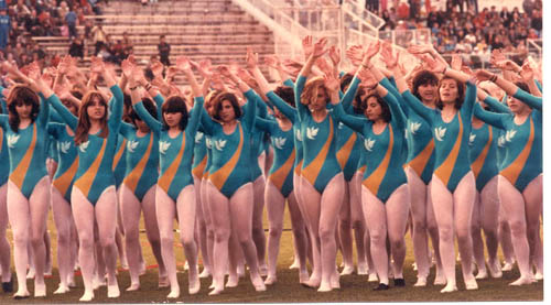 Girls in tight leotards performing for John Paul II